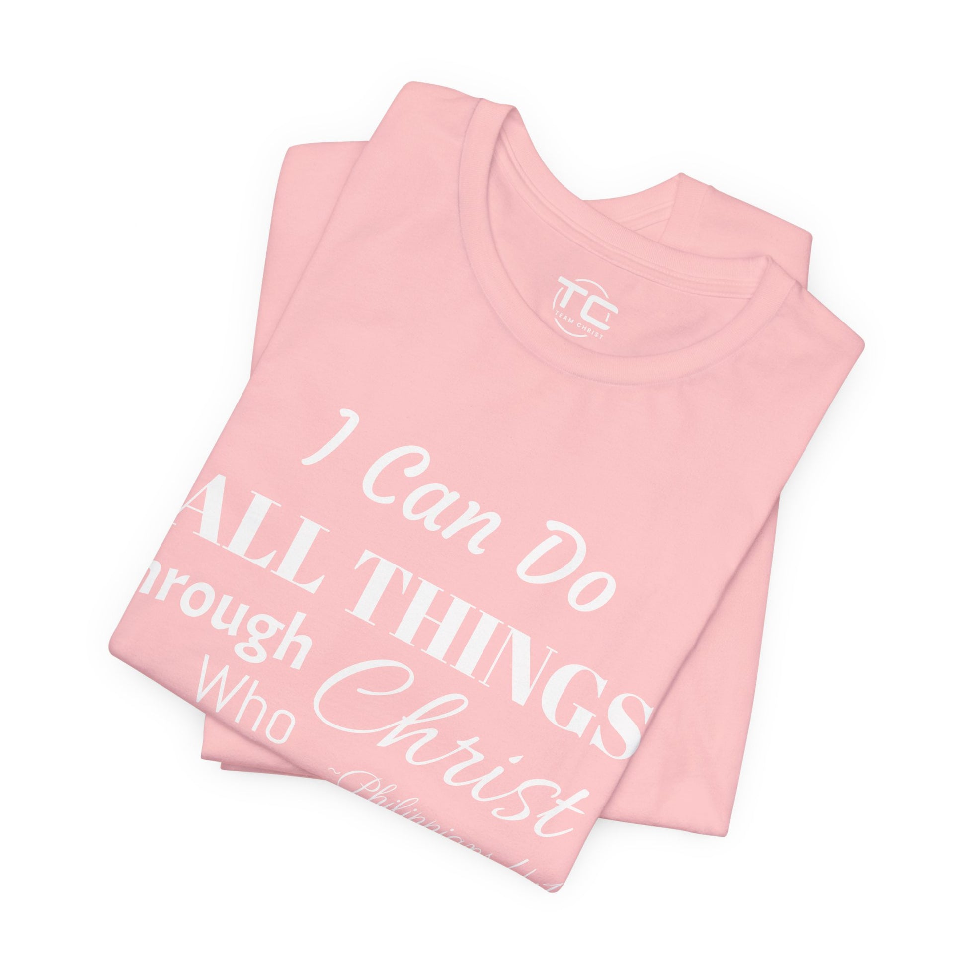 Pink Christian themed shirt inspired by Philippians 4:13 featuring a stylish design, perfect for cool Christian tees collection. Folded front Image