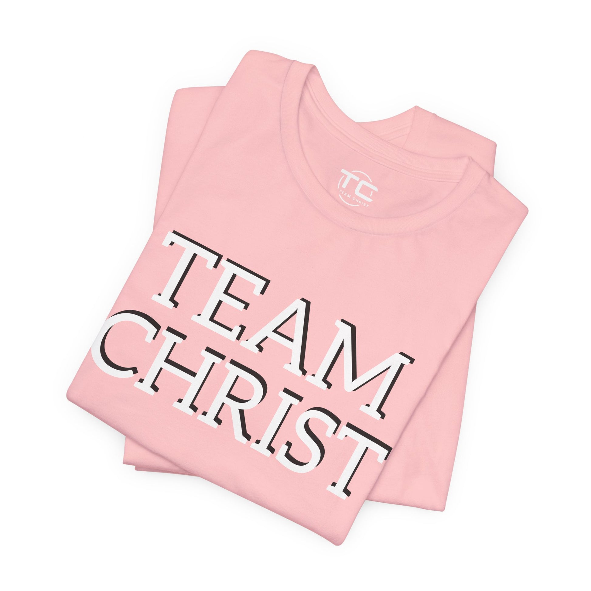 Pink Christian themed shirt featuring a stylish design, perfect for cool Christian tees collection. Folded front Image
