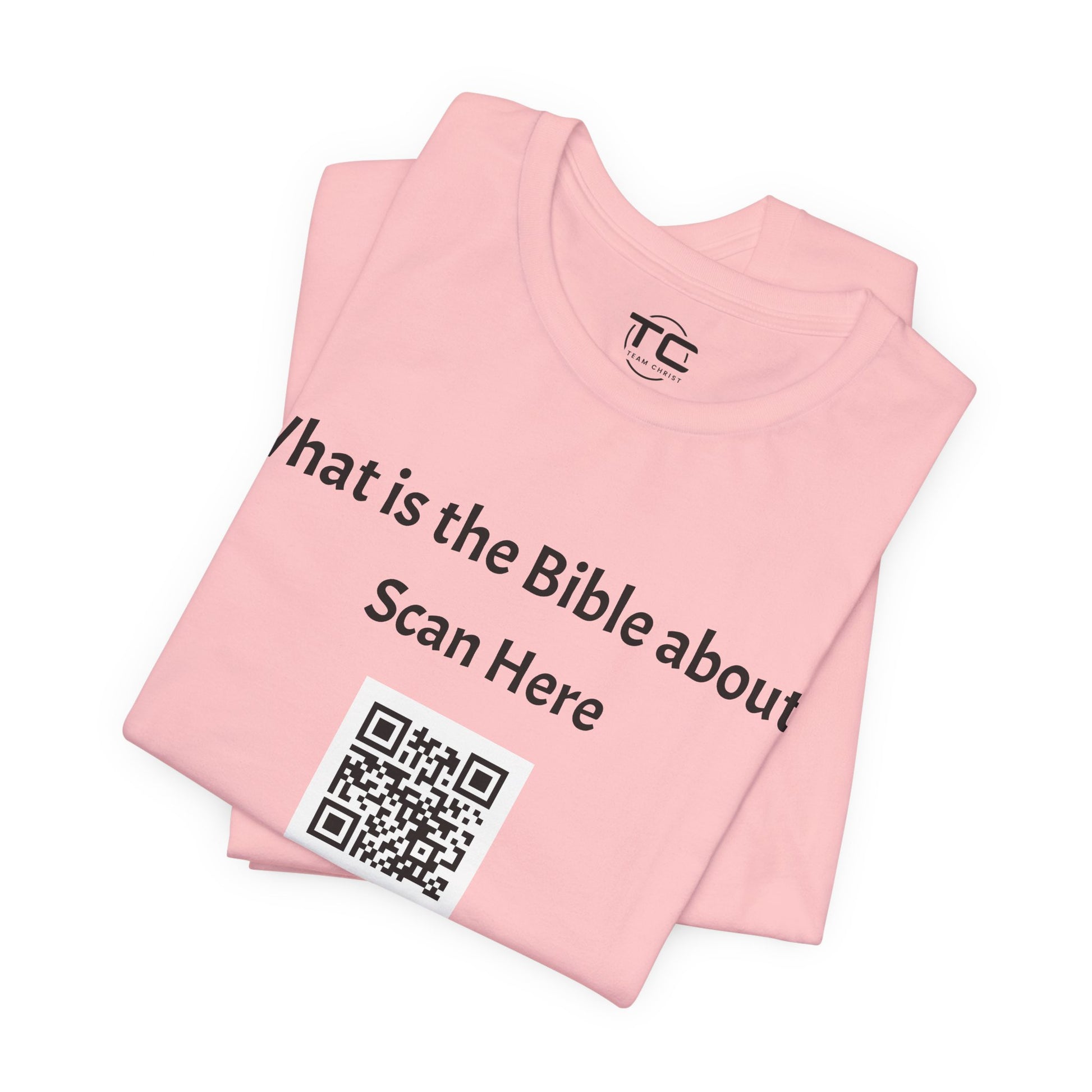 Pink tee shirt with a QR Code linking to a Christian blog "What is the Bible about"?, perfect for sharing biblical blog content. Front folded Image