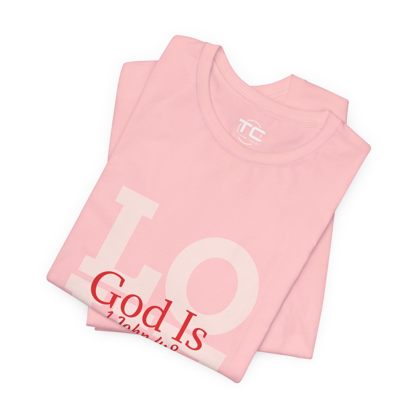 Pink Christian themed shirt inspired by 1 John 4:8 featuring a stylish design, perfect for cool Christian tees collection. Front folded Image